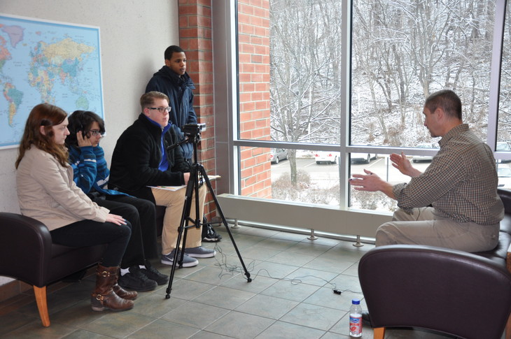 Future filmmakers from McKeesport High School’s digital media class shot footage and conducted an interview with Penn State Greater Allegheny admissions counselor Dave Davis, right.